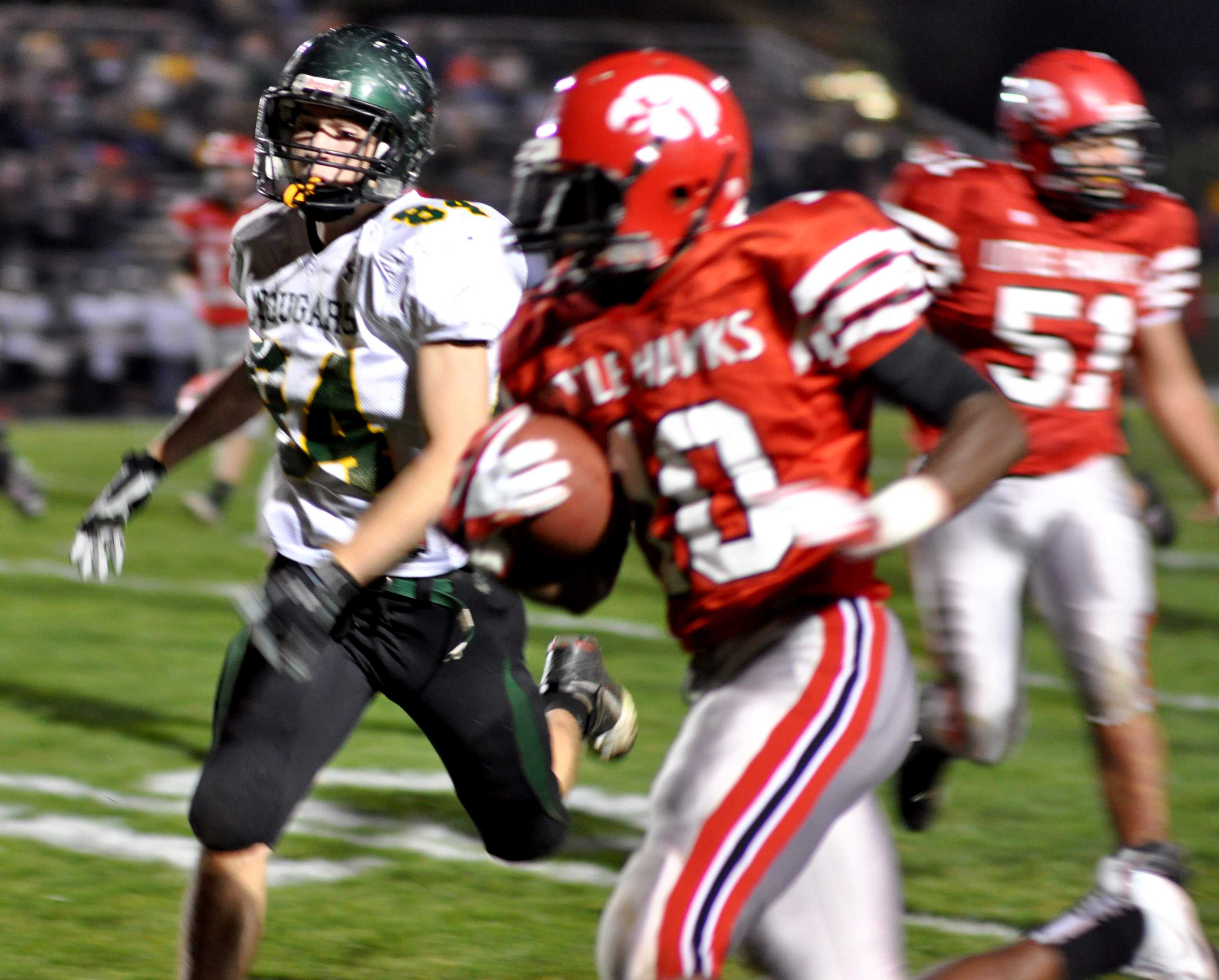 Number 84, Tommy Kaiser, jr., goes after the ball.