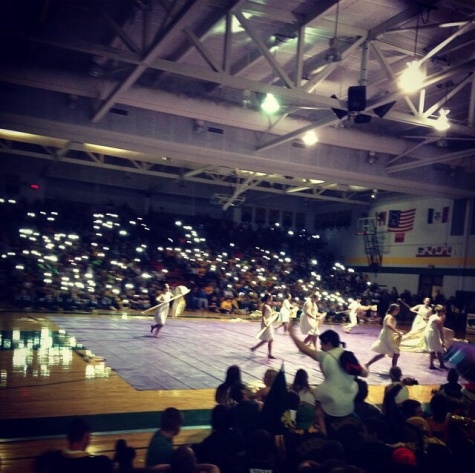 Kennedy winter guard performs at the winter pep assembly.