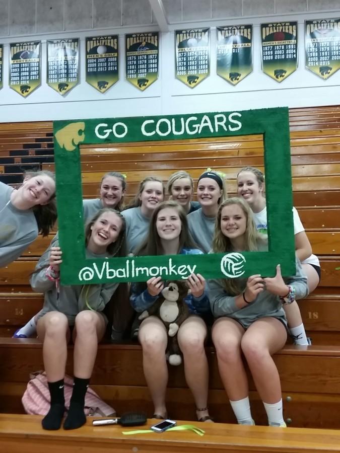 Varsity cheering on the sophomore team, who also won in three straight sets.