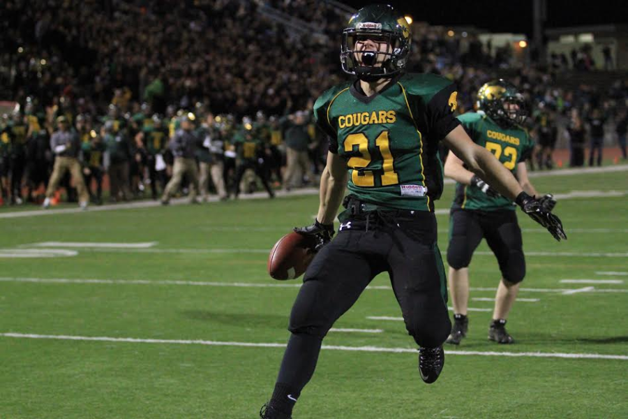 Tyler Dralle celebrates after scoring a touchdown. 