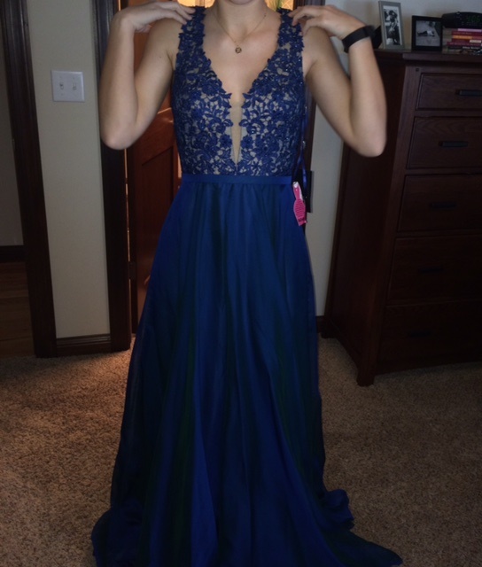 Senior Olivia Weigel tries on her prom dress.