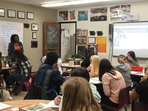 Communications specialist Meryn Fluker speaks with Introduction to Media students Oct. 14, offering advice and ideas for writing and journalism careers. 