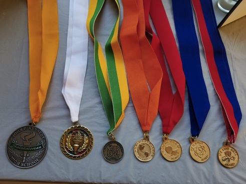 Medals. Ashlynn laid out her graduation medals on a table in her sun porch for guests to view. 
