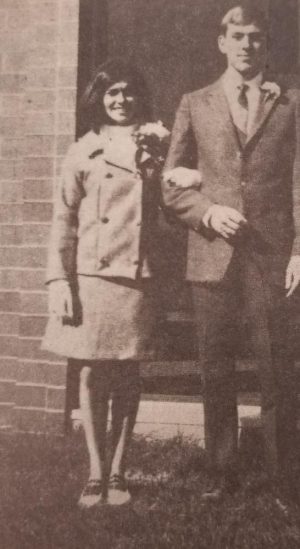 Dyan Kach and her escort, Rick Netolicky, after being presented to the 1967 Kennedy student body at a pep assembly. 