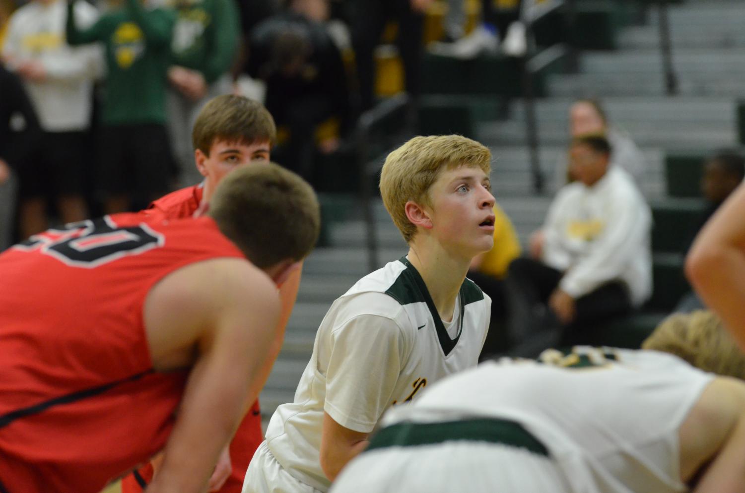 Jackson Foley stands at the line for his second free throw of the game against Linn Mar. Kennedy lost to Linn Mar 59-44. Picture by Lizzie Frost.