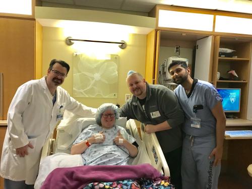 Leah and her husband Sean (Center Left and Right) , surrounded by the doctors that treated her during the Fetal Surgery.