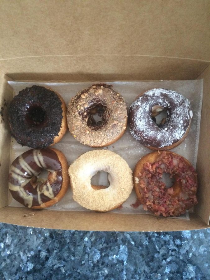 Donuts+from+the+Donut+Experiment+%2C+located+at+5300+Fountains+Drive+in+Cedar+Rapids.+Some+favorite+flavors+are+bacon+with+maple+drizzle+--+which+was+so+good%2C+Im+not+going+to+lie.+And+vanilla+with+graham+cracker+and+chocolate+with+powered+sugar+are+donuts+to+experiment+with.+