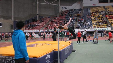 Logan levendusky fr., jumping over the beam for his high jump height.