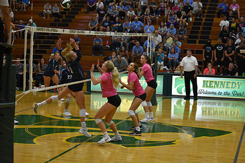 Anderson preparing to go up for a block against the J-hawks rightside hitter.