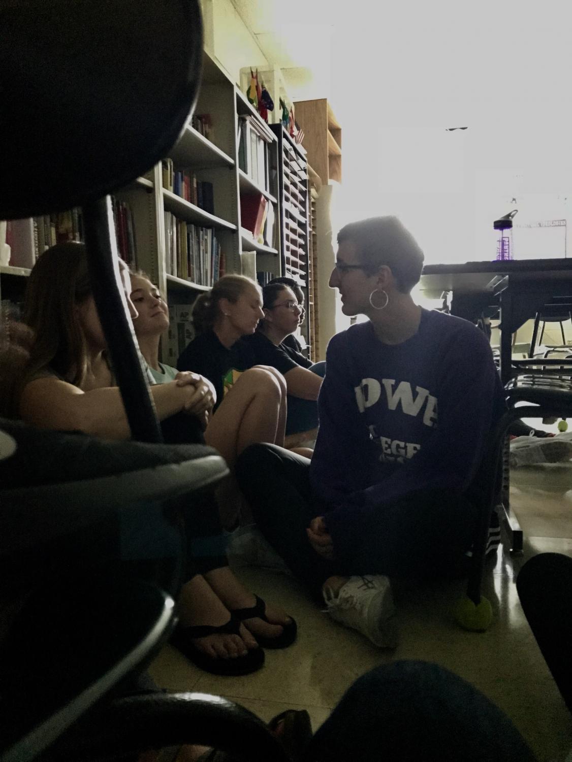 Kennedy students in Mr. Evans' sixth period AP United States Government class huddle in the corner of his room during the 'Hide' lock down drill that occurred on Aug. 28.