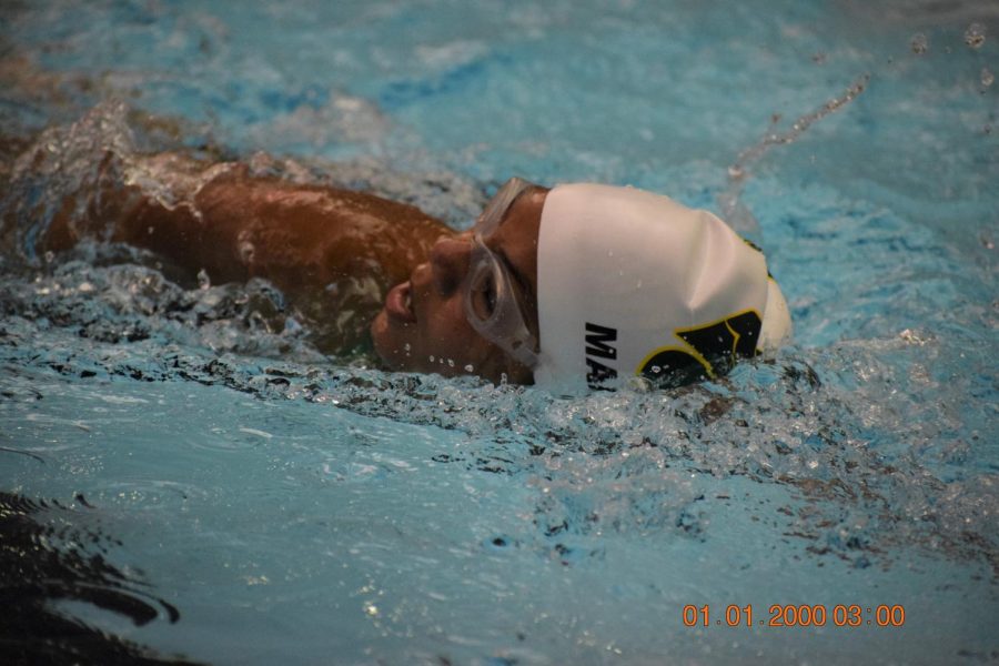 Freshman Nevaeh Mangrich, swimming 500 freestyle.