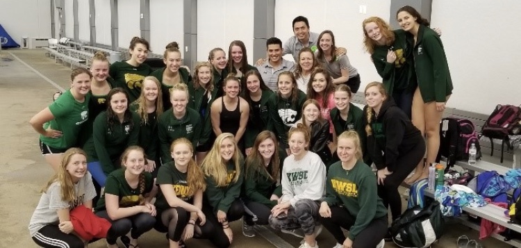 The swimmers and coaches at the MVC Sophomore Conference(October 20) pose for one last photo with Ivan before he leaves to coach at SIU. Photo by Allison Gardner.