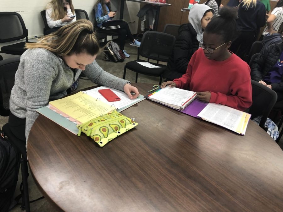Lydia Heskje, so., and Grace Ntanyungu, fr., studying for their tests and finals in French class.