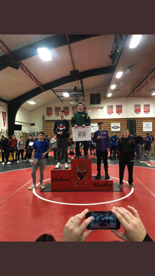 Dylan Falck receiving first place at Fort Madison Invitational on Dec. 15, 2018.