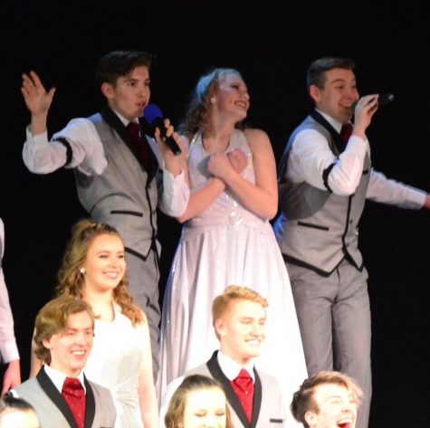 Junior Wolfgang (Amadeus) Borchardt, junior Betsy Marlow and senior Brayden Remerowski sing at the Going Out Concert on Thursday, March 7. Remerowski and Borchardt usually switch off singing the solo, but this time they sang together.