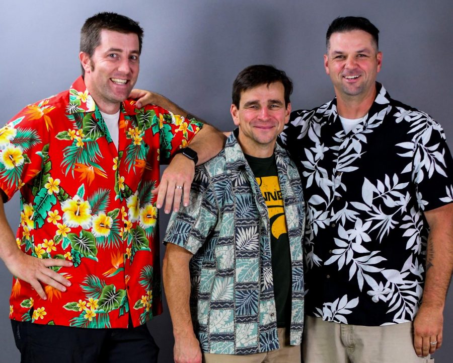 Dan Carolin (in the middle) and his squad pose in their Hawaiian shirts.
