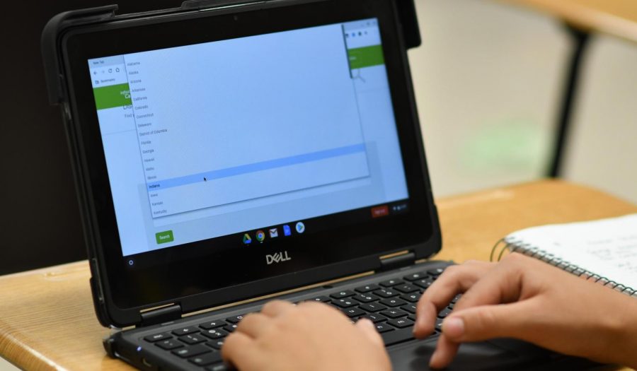 Student at Kennedy High School attempting to maneuver Infinite Campus on their new chromebook.