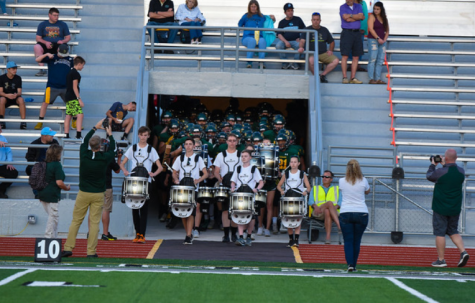 The Kennedy marching band entering before a football game last season.