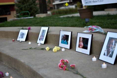 Photos of victims of police brutality were placed on the stairs during the vigil. Attendees of the vigil laid flowers, candles and other memorabilia by the photos.