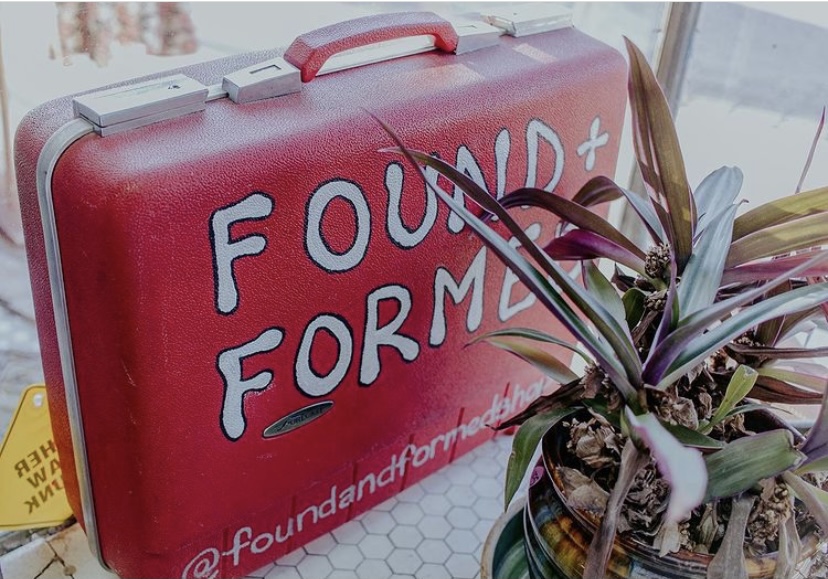 A suitcase painted with the Found + Formed logo. Courtesy of Found + Formed Instagram.