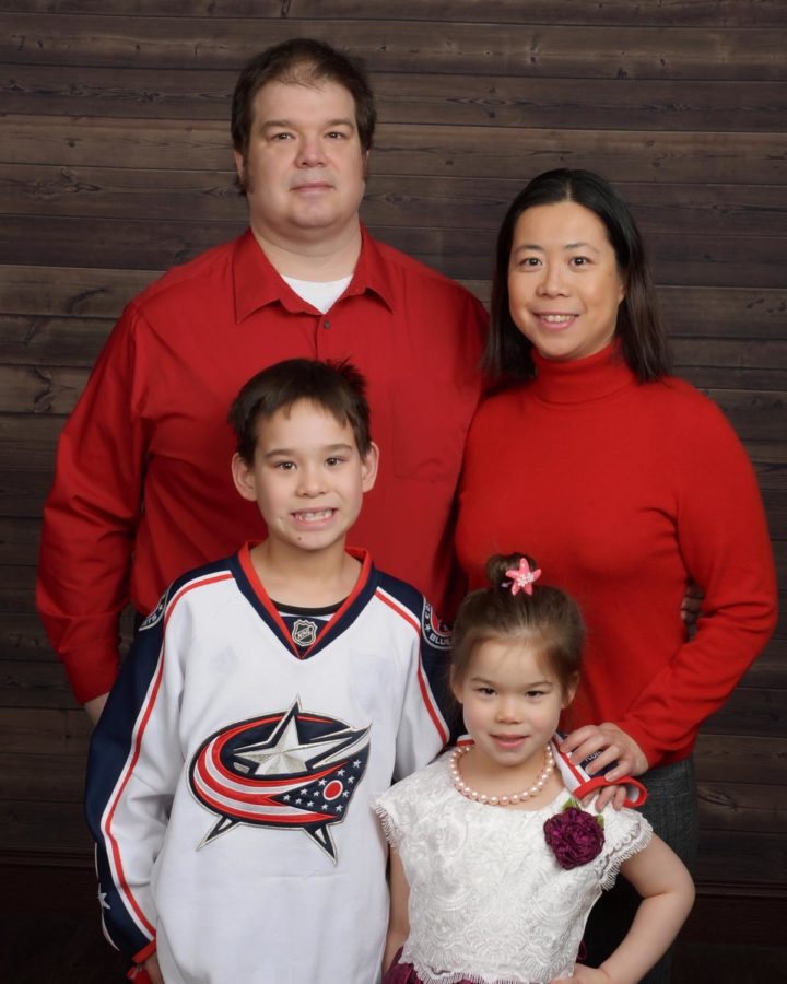 Paul Barnard, his wife Xin, son Mikael, and daughter Bethany all smile for a family photo in 2018.