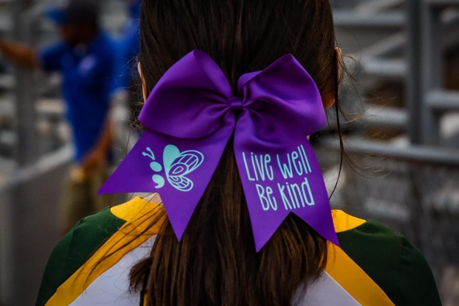 Kennedy+cheerleaders+wear+purple+bows+for+the+month+of+September+for+Suicide+Awareness+month.