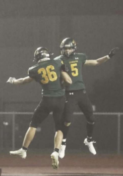 Colin Flannagan (#36) celebrates with wide receiver Jeron Senters (#5) after scoring a touchdown against Washington on September 10th, 2021