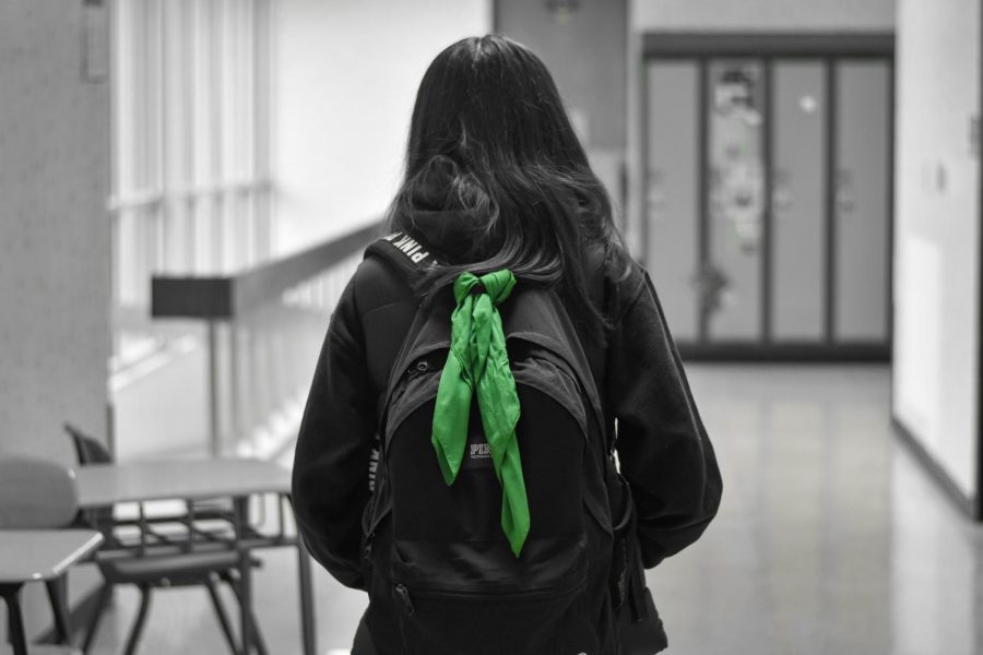Kennedy+students+trained+for+Green+Bandana+are+given+a+bandana+to+tie+to+their+backpack.