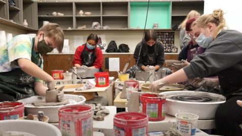 Students work on their ceramic projects for art class.