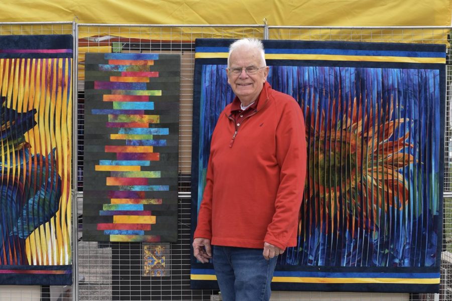 Don Dixson stands surrounded by his art. From left to right: Dancin' Iris, No Rhythm and Glory to Ukraine.