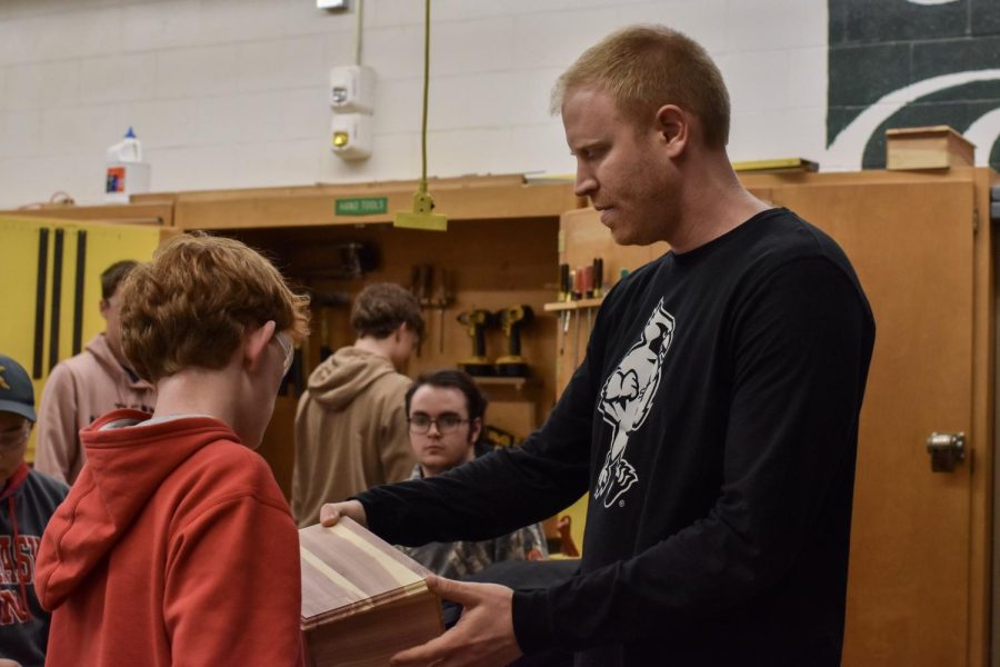 Jake Hemann helps a student during one of his classes.