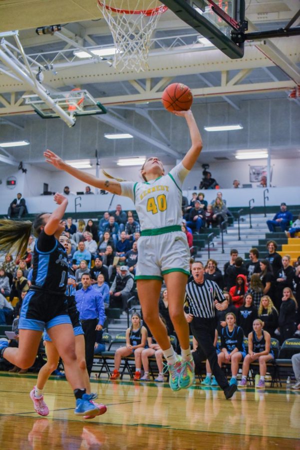 Senior Kaliyah Sain makes a two-point shot over Jefferson.