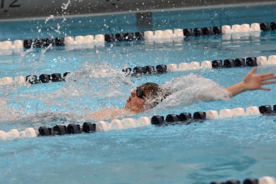 Colton Klein swims backstroke.