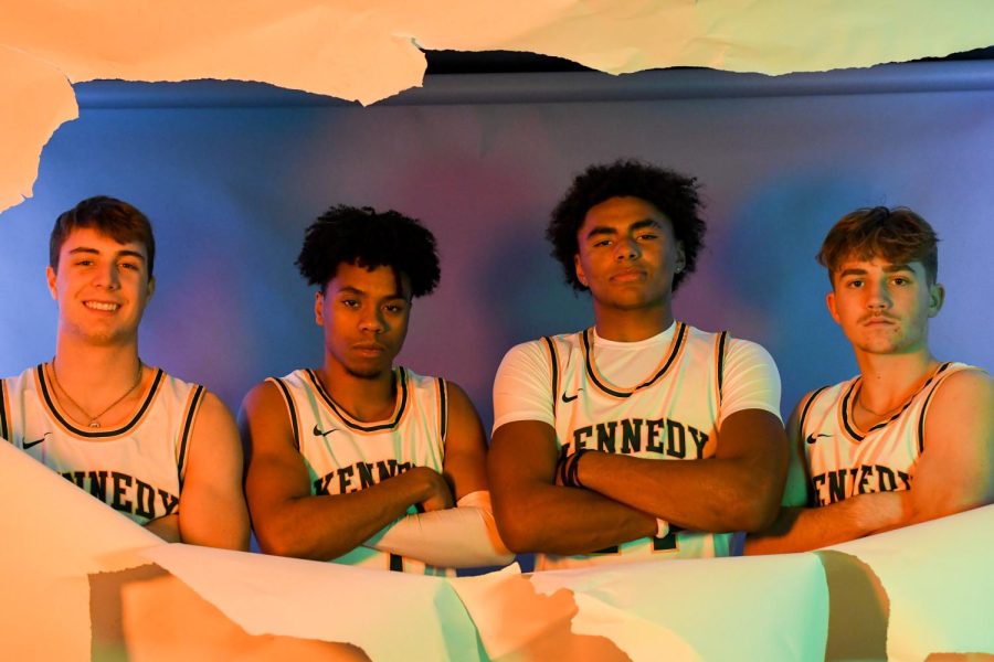 Varsity starters pose for team picture in the photo studio.