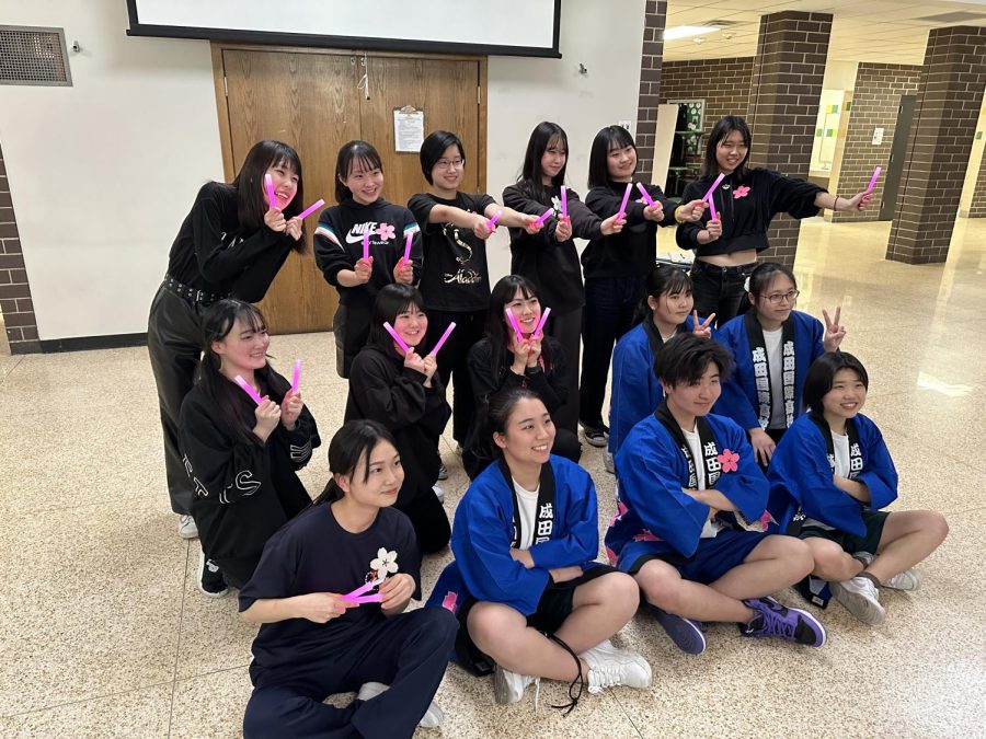 Japanese exchange students pose for a photo in their uniforms.