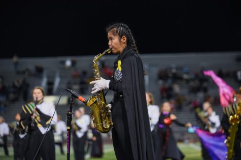 Senior Charlotte Ottemoeller plays alto saxophone for Kennedy Marching Bands 2022-2023 show, Black Widow.