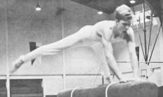 Former Kennedy gymnast, Bruce Skow springs over the long horse at a gymnastics competition. 