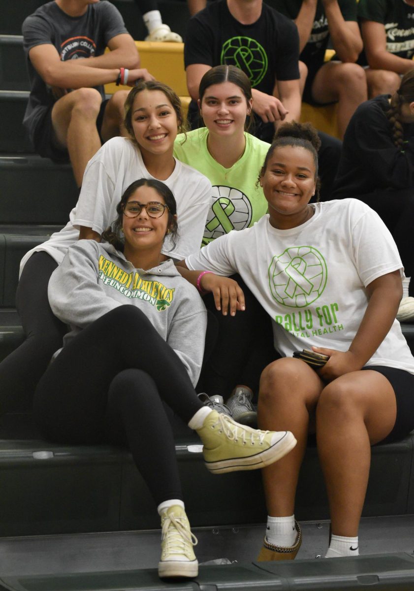 Kennedy volleyball fans pose for a picture.