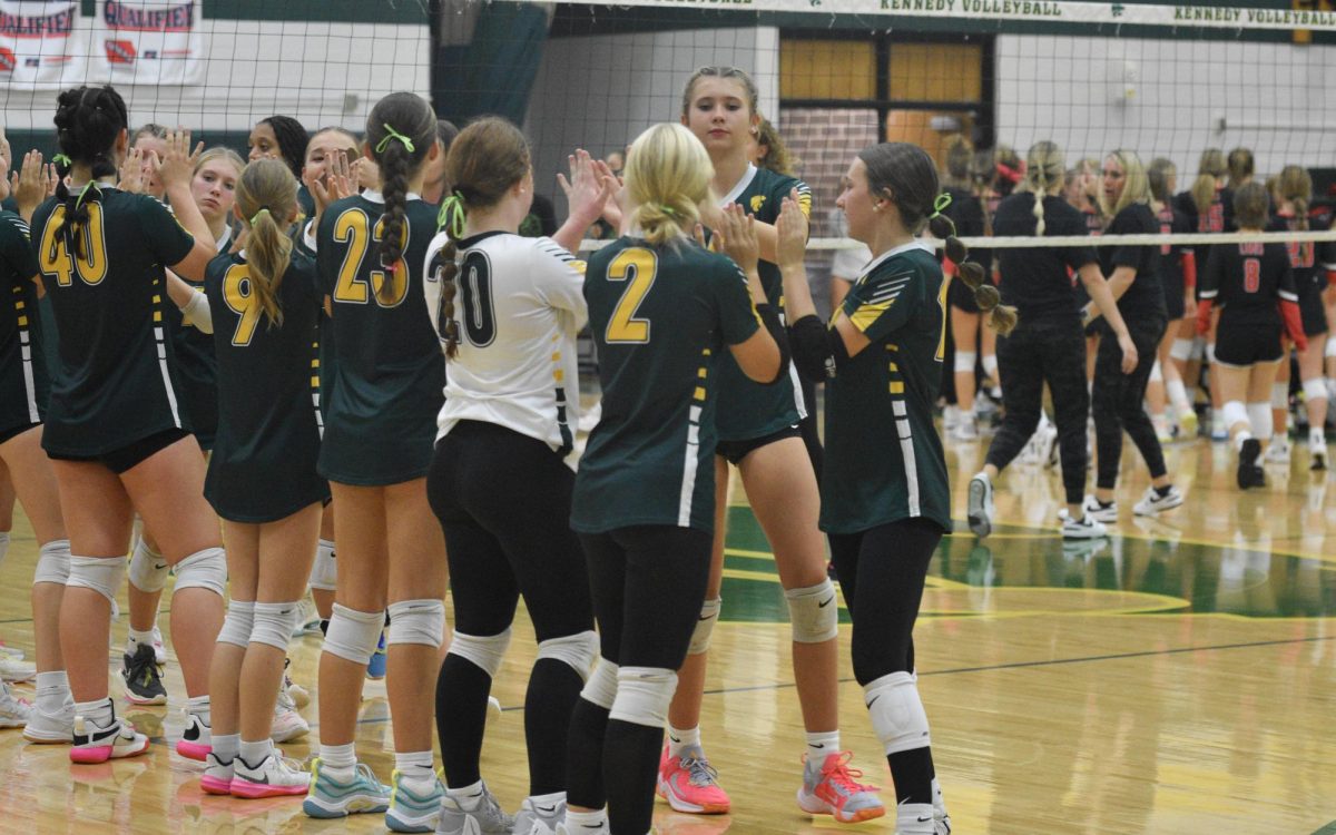 Kennedy sophomore volleyball team does their post-game handshake.