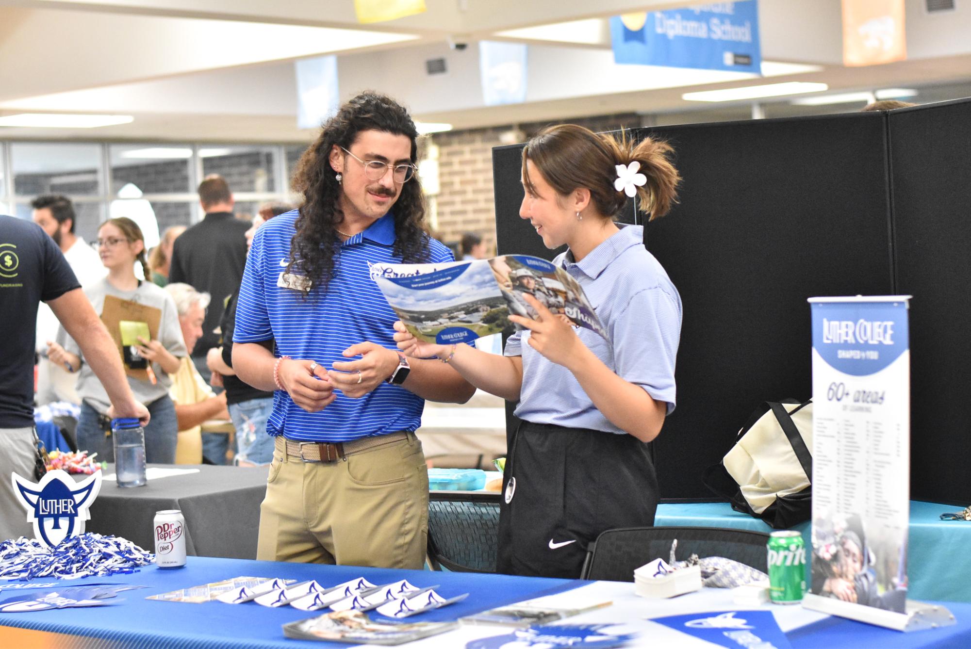 Representatives discuss college options at the annual Kennedy Open House.