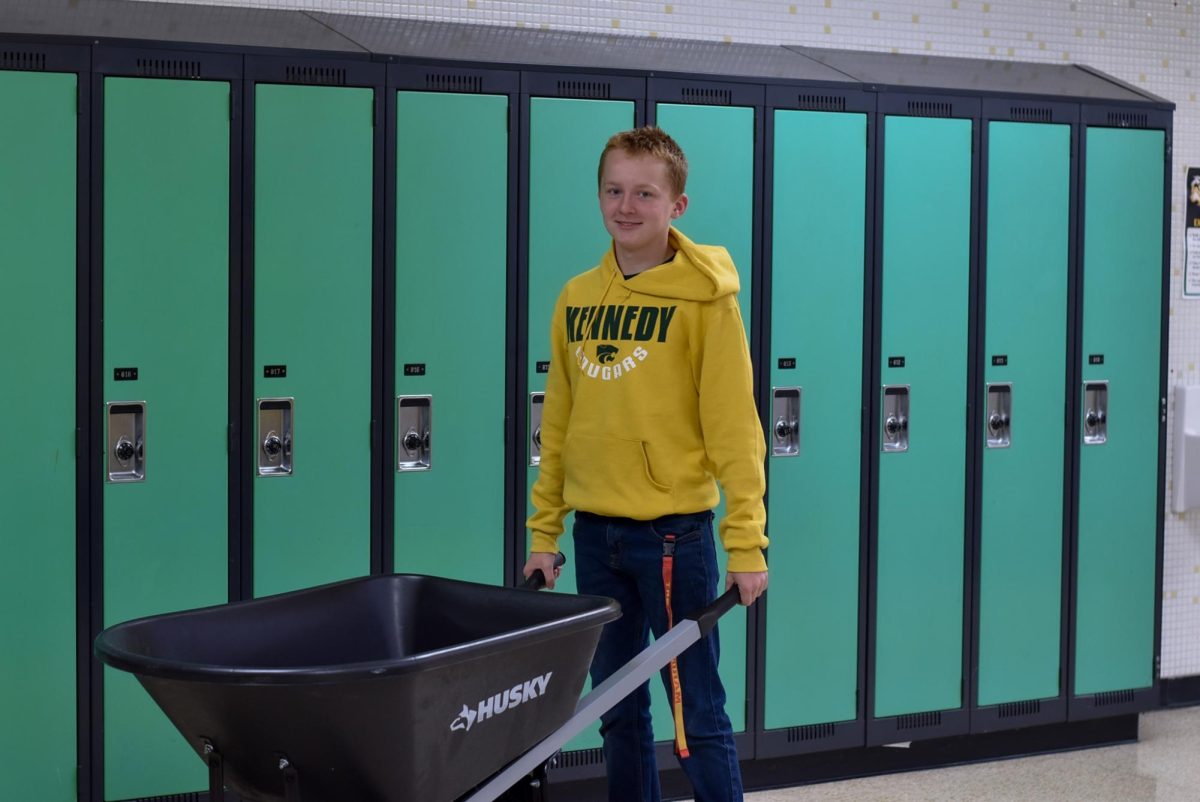 Sophomore, Logan Ratcliff brings a wheel barrel for anything but a backpack day.
