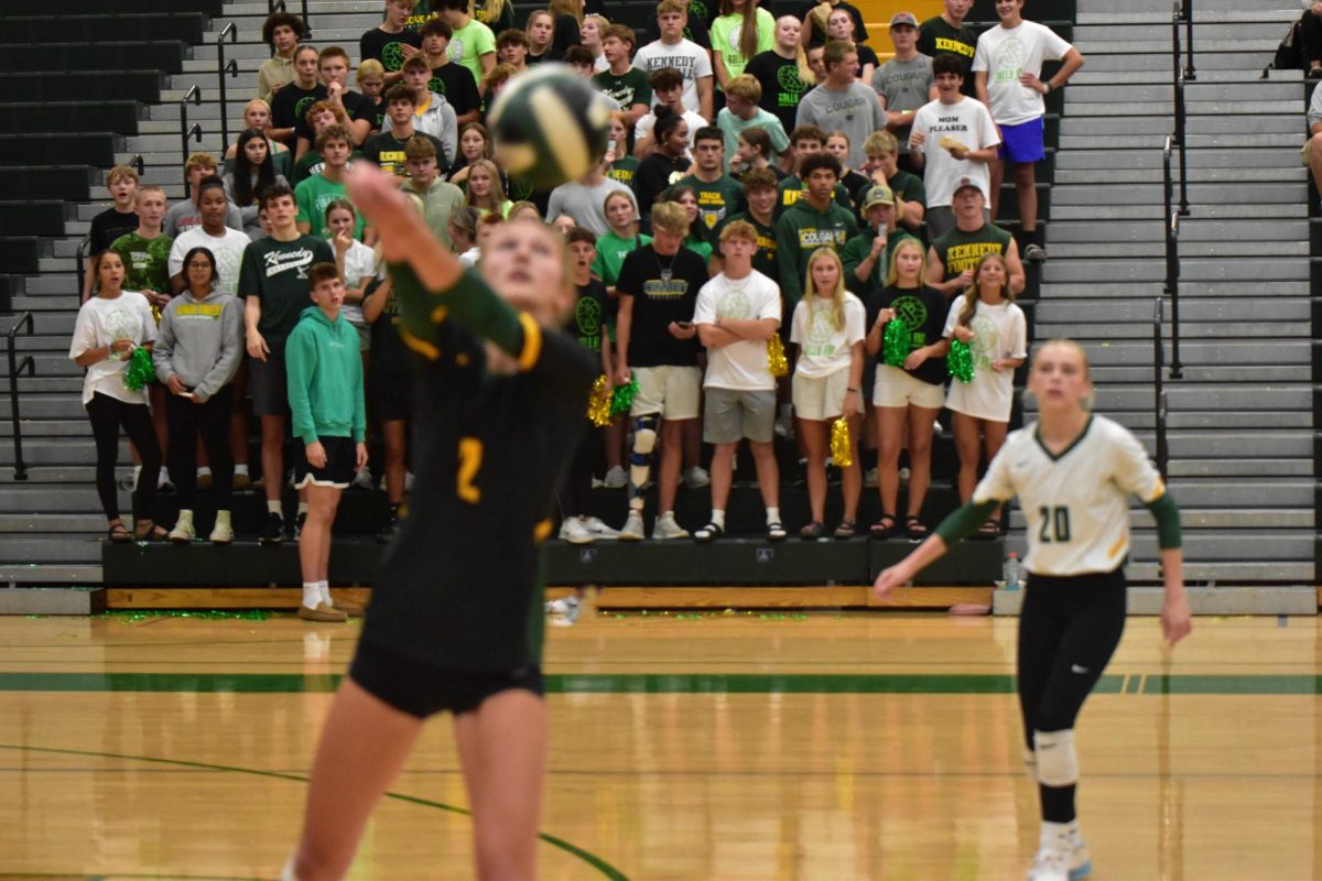 Kylie Johannes (2) saving the game while her teammate Izzy Presley (20) and the crowd watches in aw 