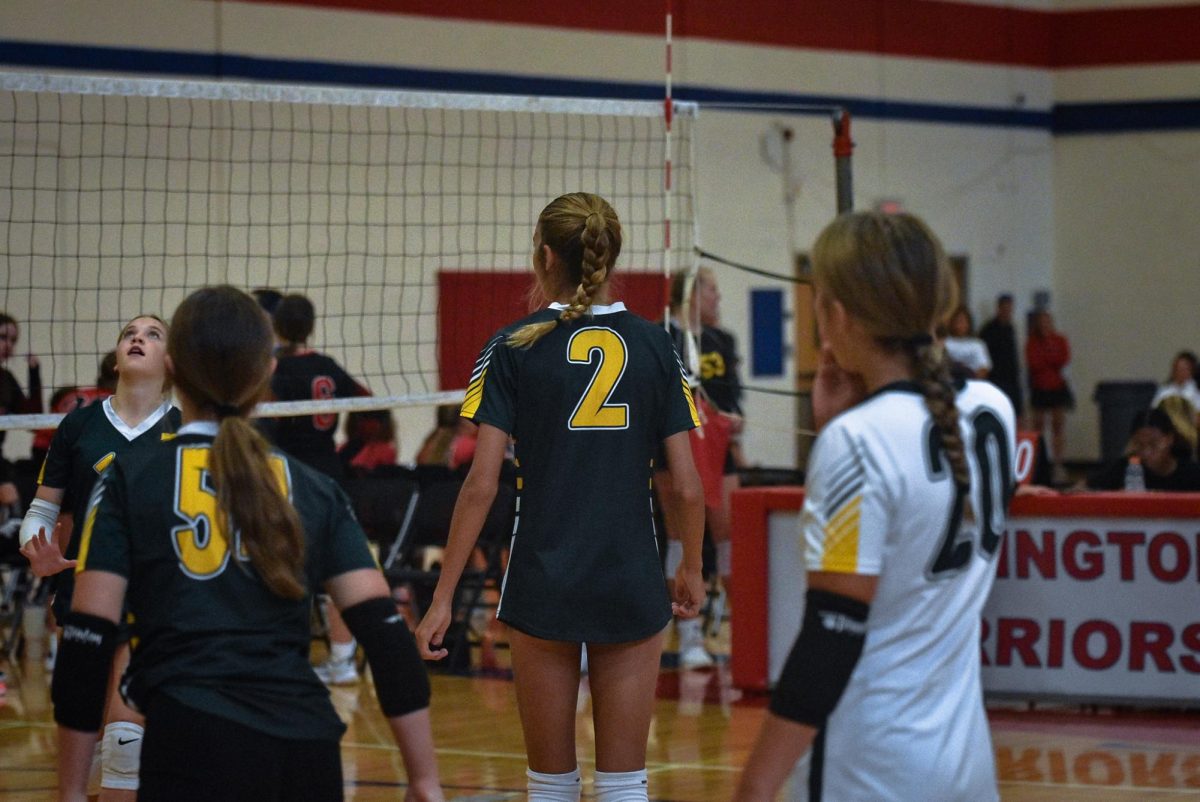 Freshman #2 Liv Boedeker eyes the opponents waiting for them to serve the ball.