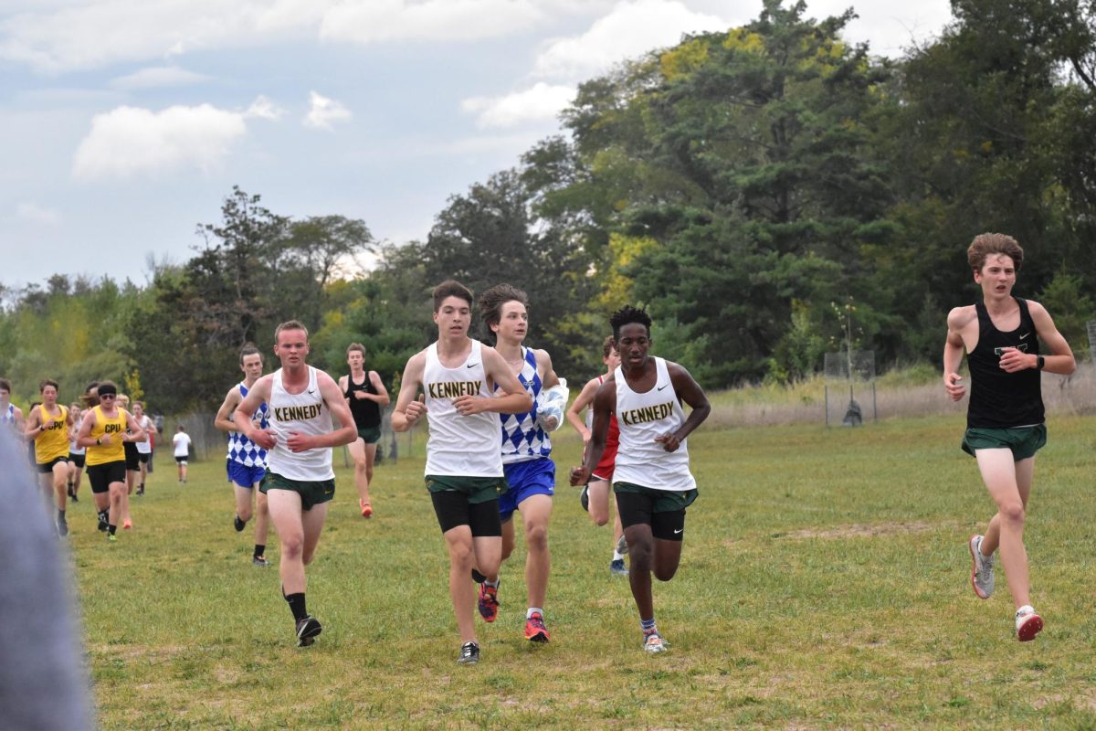 Sophomore Grant Pattridge (middle) races next to his teammates Christian Hodgins (left) and Sintayehu Hall (right).
