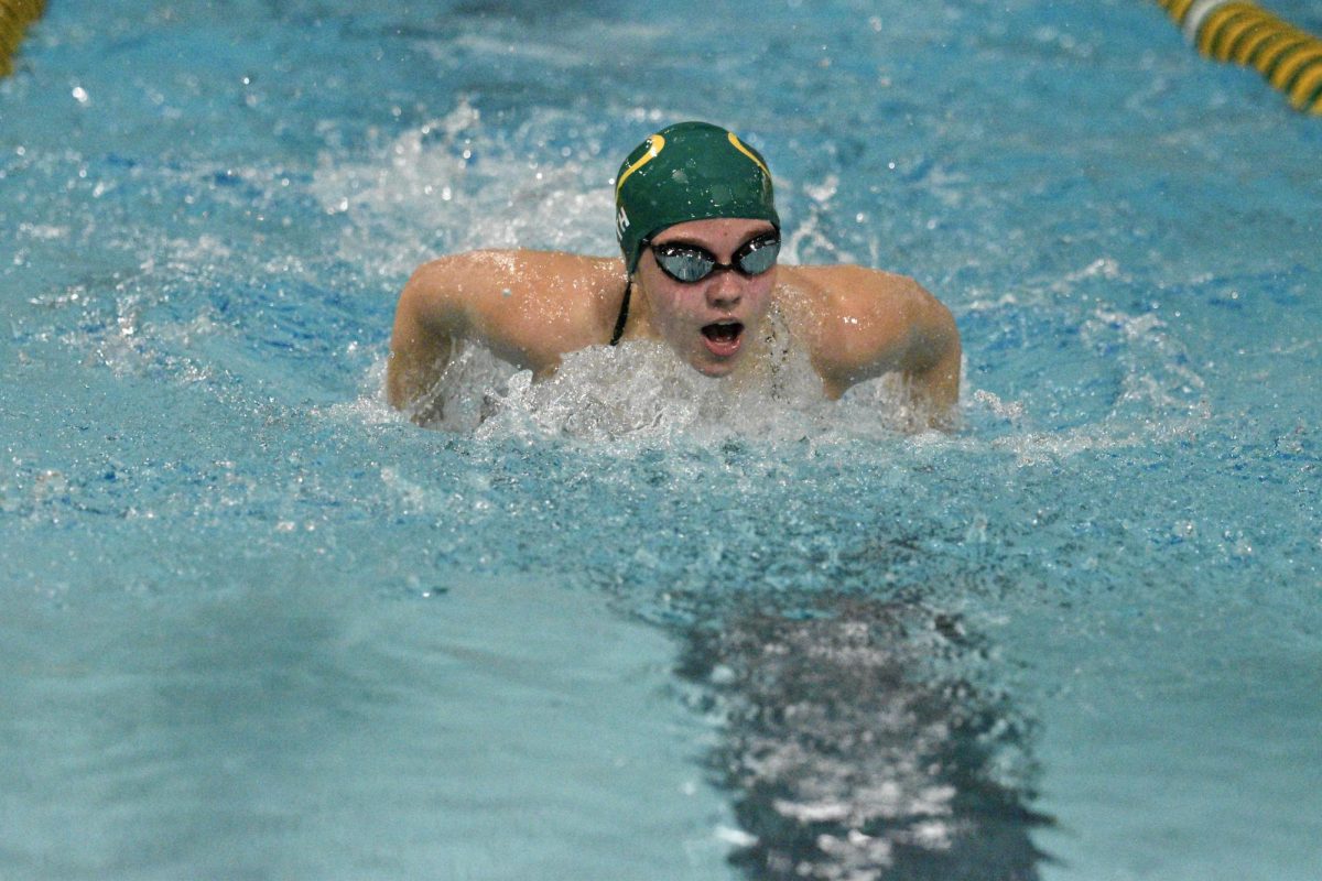 Sophomore Lydia Lueth swims the second leg of the 200 Yard Medley Relay.