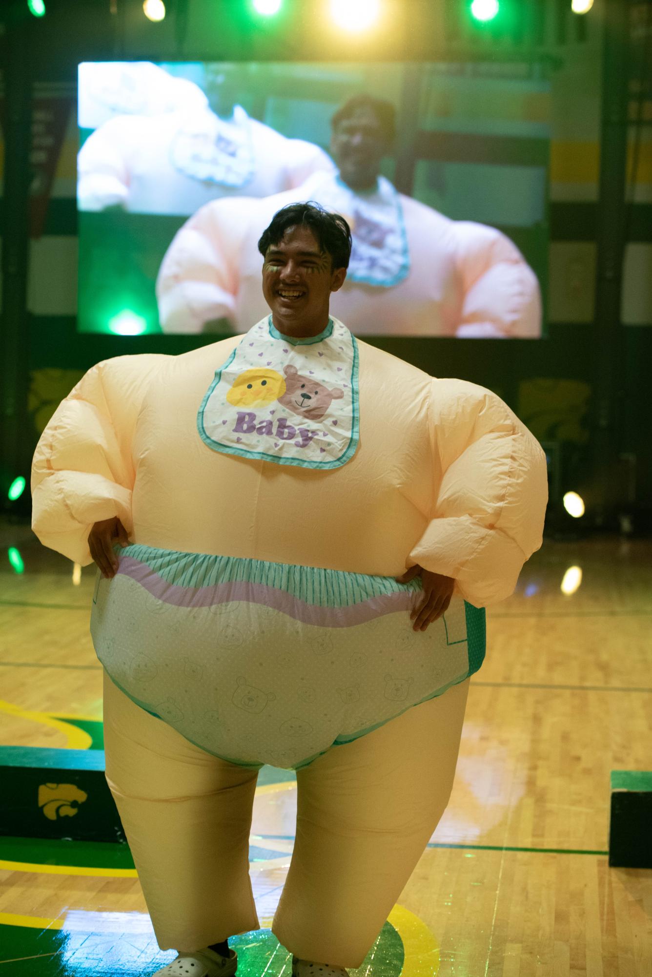 Senior Safal Bhattarai participates in the 'Best Outfit' challenge at a pep rally.