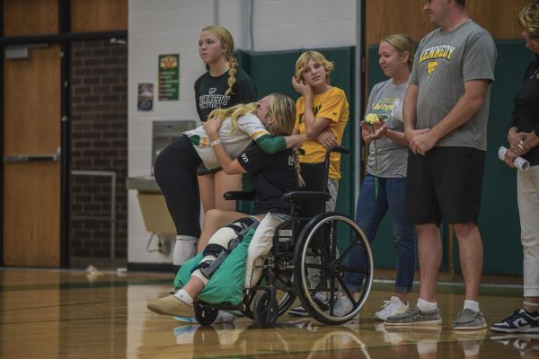 Senior Laikin Wood steps out of her way to hug her injured teammate and long-time friend senior Aliya Ballard during their final home game of their high school careers.