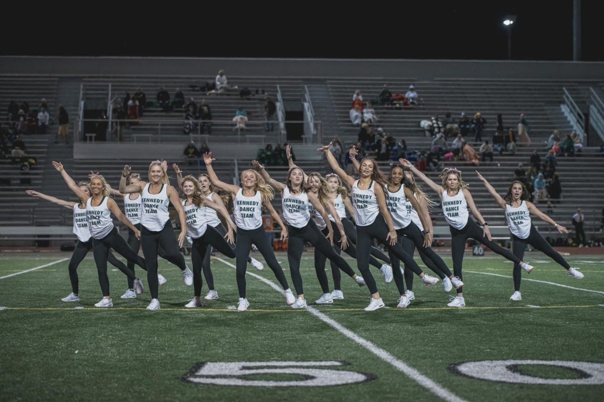 In a clump, the Kennedy Varsity Dance Team strikes a move