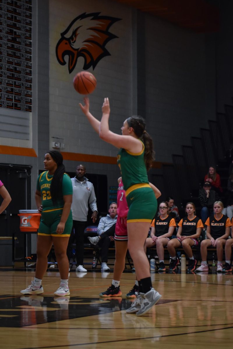 Putting up a shot, sophomore Alaina Canney shoots a free throw.