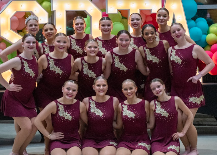 Kennedy Dance Team joins together for a picture after their jazz routine.